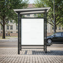 Empty city bus stop advertising billboard on street