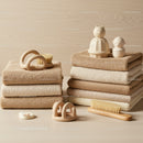 Neatly Folded Towels with Baby Care Accessories