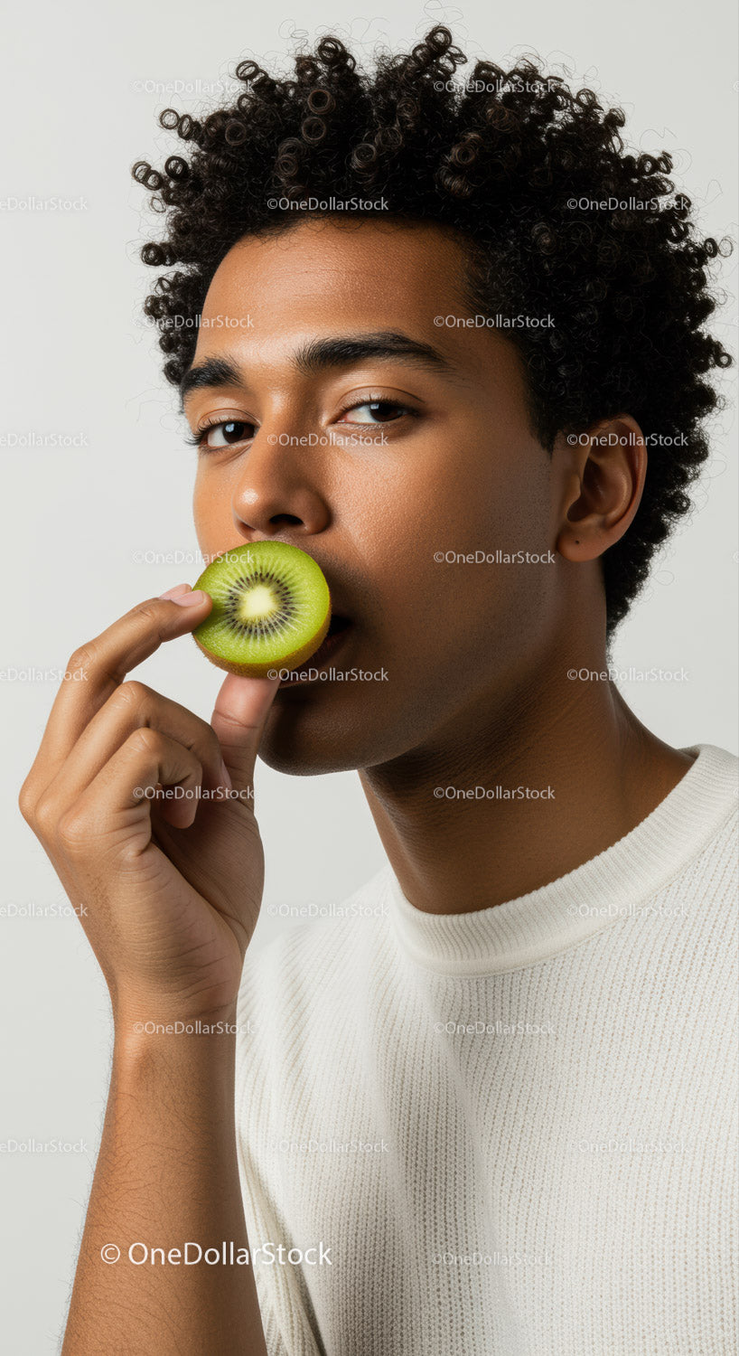 Young Woman Eating Fresh Kiwi Fruit in Stylish Health and Wellness Scene