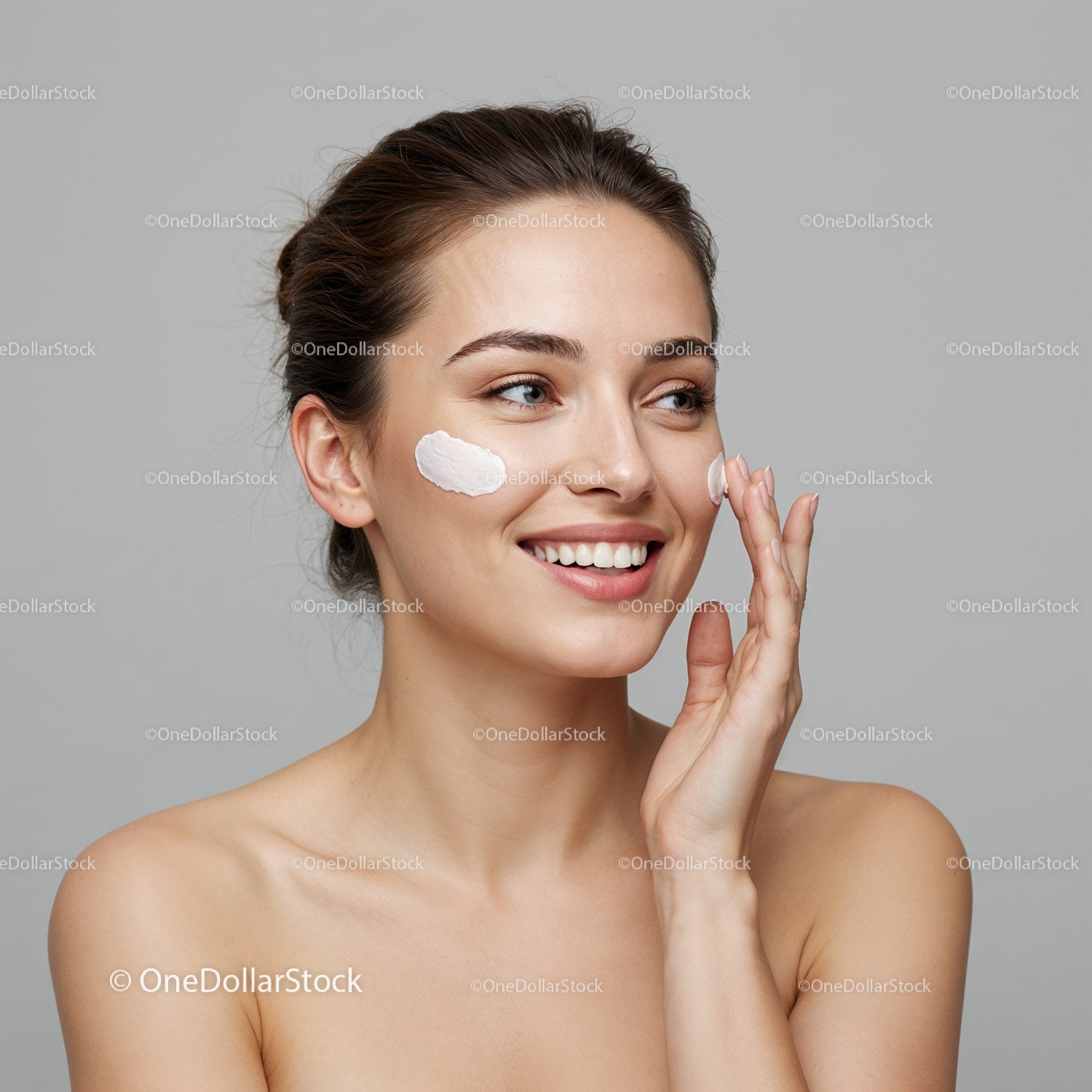 Beautiful Woman Applying Skincare Cream with Fresh Skin and Joy