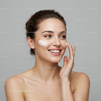 Beautiful Woman Applying Skincare Cream with Fresh Skin and Joy