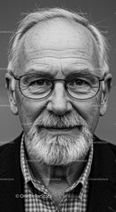 Thoughtful elderly man with glasses and white beard