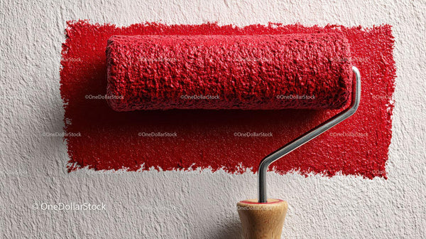 Red Paint Roller Applying Bright Red Wall Paint
