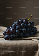 Fresh dark grapes on rustic fabric background
