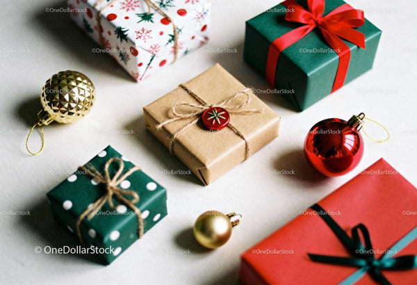 Festive Christmas gifts with decorative ornaments on table