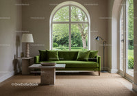 Modern living room with green sofa and large window