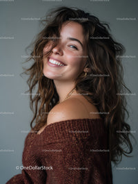 Beautiful Woman with Curly Hair Wearing Rust Sweater Smiling Portrait