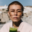 Young Woman with Short Hair and Sunglasses in Summer Outdoor Scene