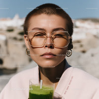 Young Woman with Short Hair and Sunglasses in Summer Outdoor Scene