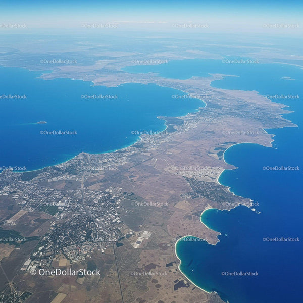 Aerial View of Glassy Blue Bays and Coastal Beaches with Land and Roads