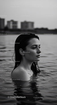 Serene Female Portrait in Water with Urban Background