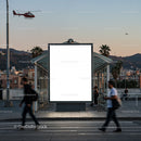 Urban bus stop with blank billboard at dusk
