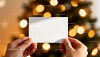 Hands Holding Blank Card with Warm Festive Lights JPG Mockup Image preview