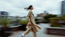 Dynamic Urban Fashion Scene with Confident Woman in Motion
