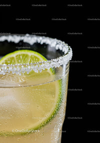 Refreshing Lime Cocktail with Salt Rim on Black Background