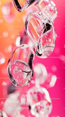 Close-up of Ice Hearts with Pink Background for Romantic and Artistic Effect