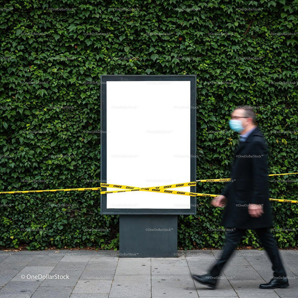 Man Wearing Face Mask Walking Past Blank Billboard Outdoors JPG Mockup Image