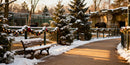 Winter zoo path with snowy bench and festive decorations