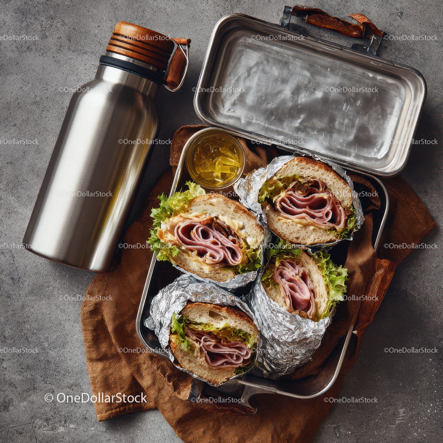 Fresh Ham and Cheese Sandwiches in Aluminum Foil with Oil and Thermos