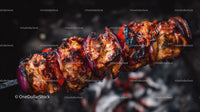 Juicy grilled chicken skewers with onion on barbecue