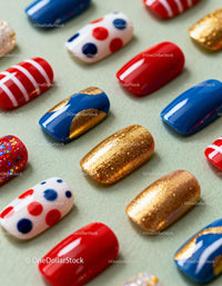 Colorful set of decorative false nails on light surface
