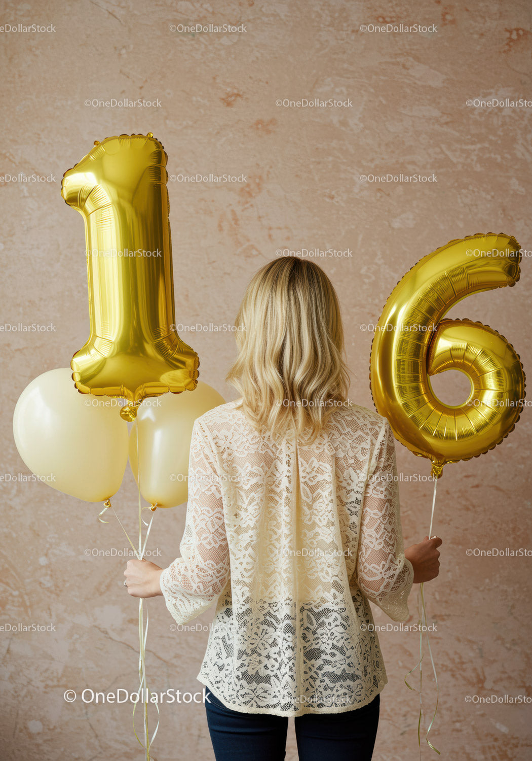 Woman holding golden 16th birthday balloons indoors