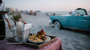 Beachside Dining with Milkshake Hamburger and Vintage Car Scene