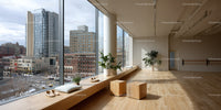 Bright Modern Room with Large Window and City Skyline View