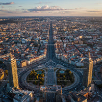 Aerial View of Downtown City with Skyscrapers and Busy Roads at Sunset