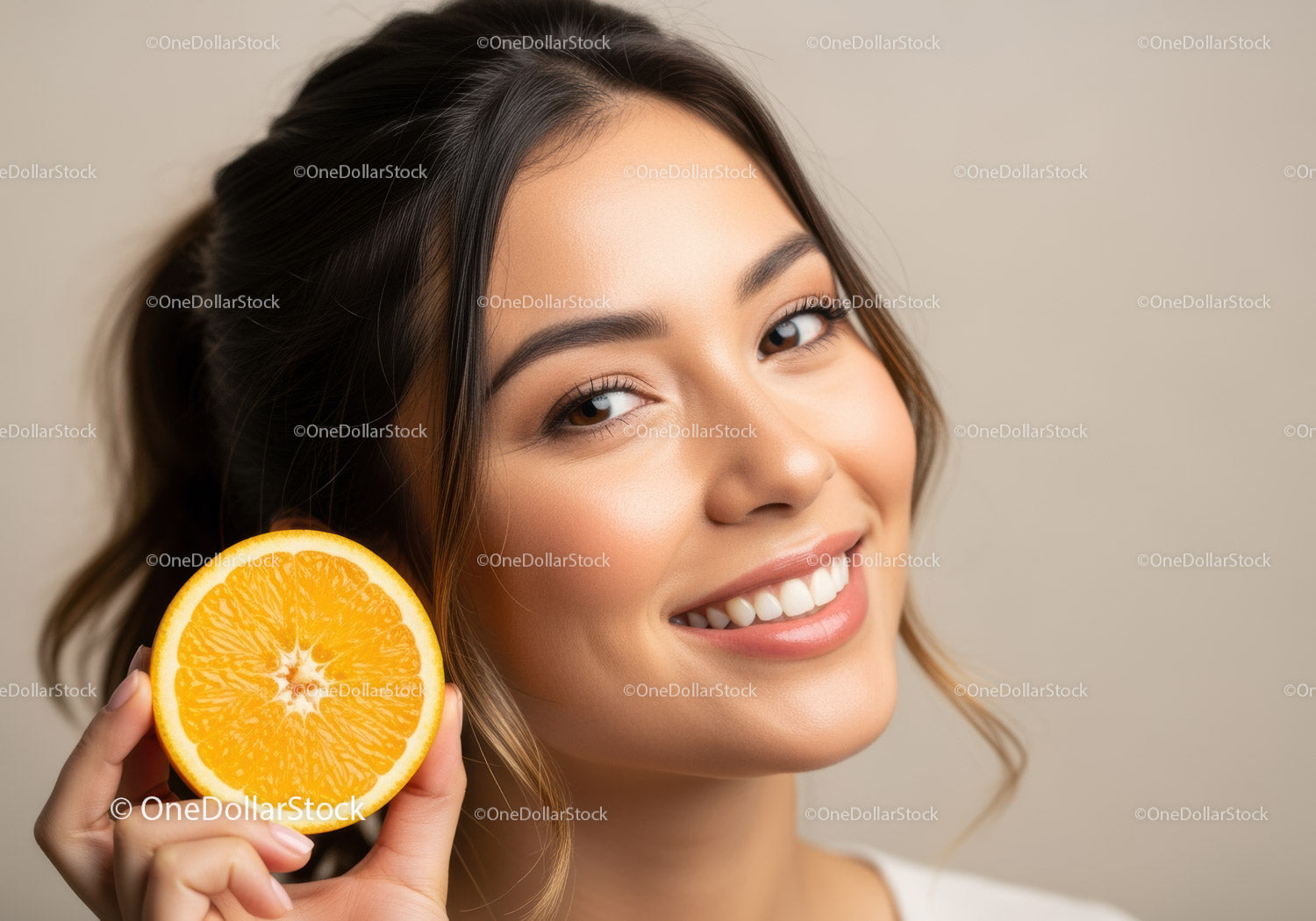 Beautiful Woman with Bright Smile Holding an Orange Slice