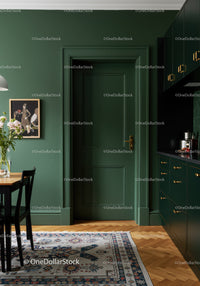 Stylish Green Kitchen Interior with Brass Accents and Wooden Flooring