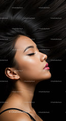 Profile of woman with long flowing black hair and makeup