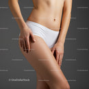 Toned Female Body in Underwear with Artistic Lighting and Neutral Background