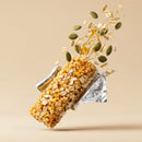 Crunchy granola bar with seeds and honey drizzle