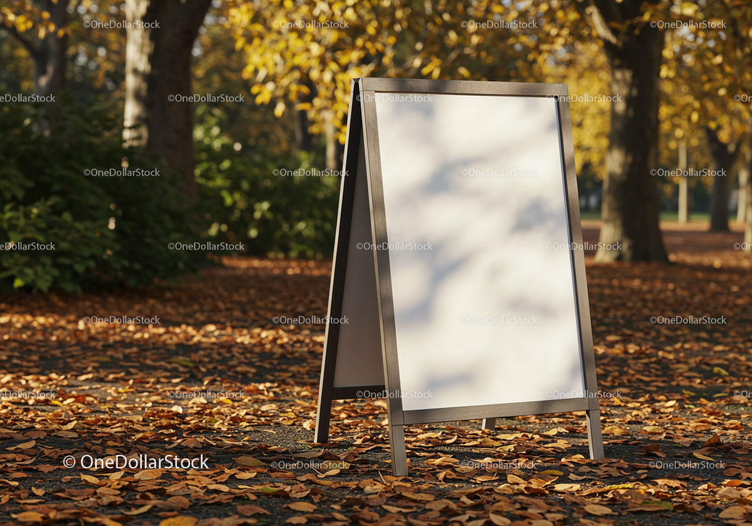 Blank sidewalk sign in autumn park with falling leaves