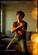 Young man expressing emotion in warm indoor light