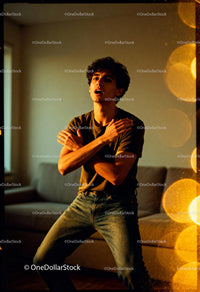 Young man expressing emotion in warm indoor light