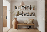 Cozy entryway with wooden bench and framed photos