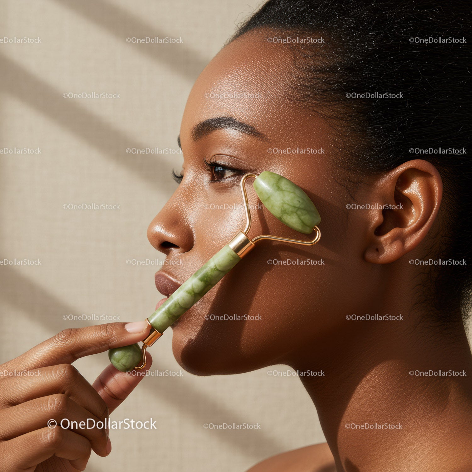 Close-Up of Woman Using Jade Roller for Facial Skincare
