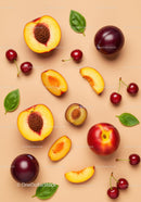 Fresh summer stone fruits with green basil leaves