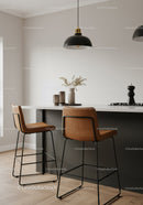 Modern Kitchen with Leather Bar Stools and Stylish Pendant Lights