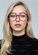Fashionable Blonde Woman Wearing Red Glasses Portrait