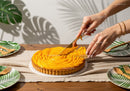 Elegant Mango Tart with Sliced Fresh Mango on a Wooden Table