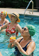Elderly Women Relaxing and Drinking Refreshing Drinks in Pool
