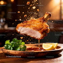 Crispy fried pork chop dipping in sauce with herbs