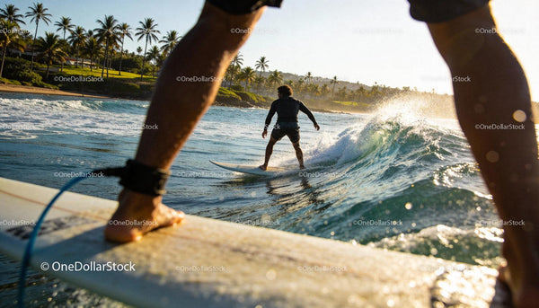Surfers enjoying perfect waves at tropical coastline
