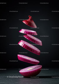 Floating Slices of Fresh Red Onion on Dark Background