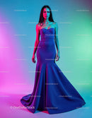 Elegant Woman in Blue Evening Gown with Vibrant Lighting