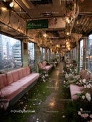 Abandoned Vintage Train Car with Pink Benches and Floral Accents in Urban Setting