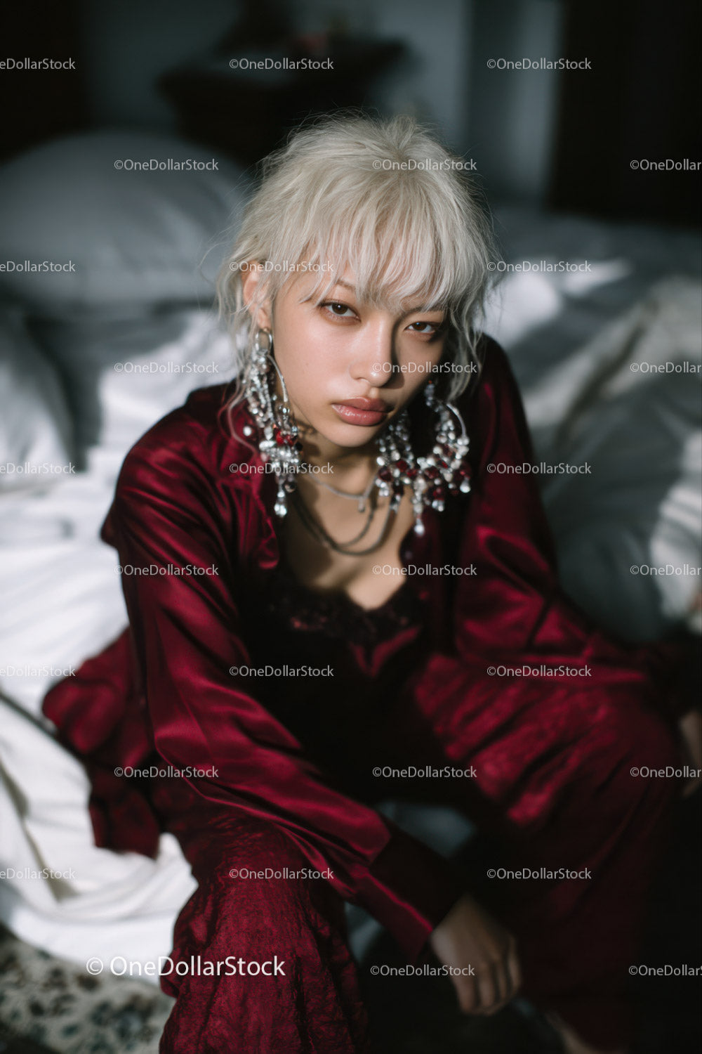 Fashionable Young Woman with Platinum Blonde Hair and Statement Jewelry